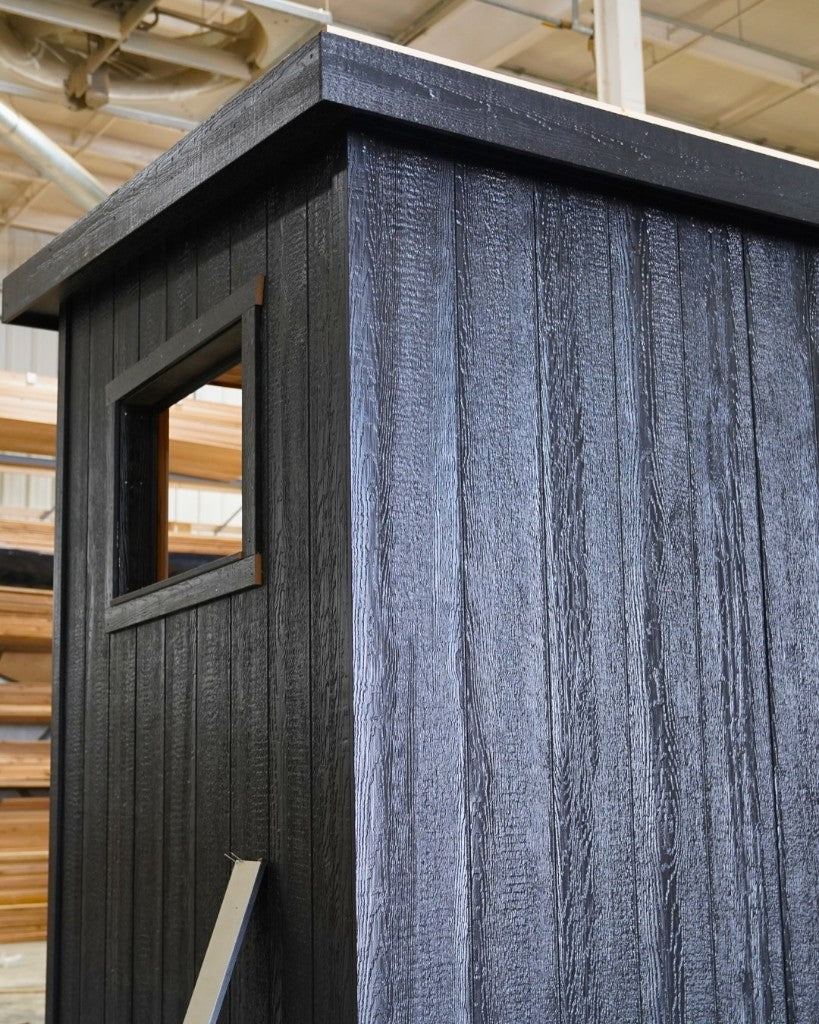 Black exterior corner and side window in the shop