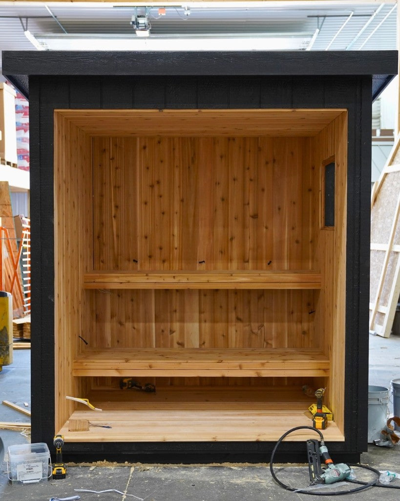 M-Series sauna mid-production, black exterior and cedar interior
